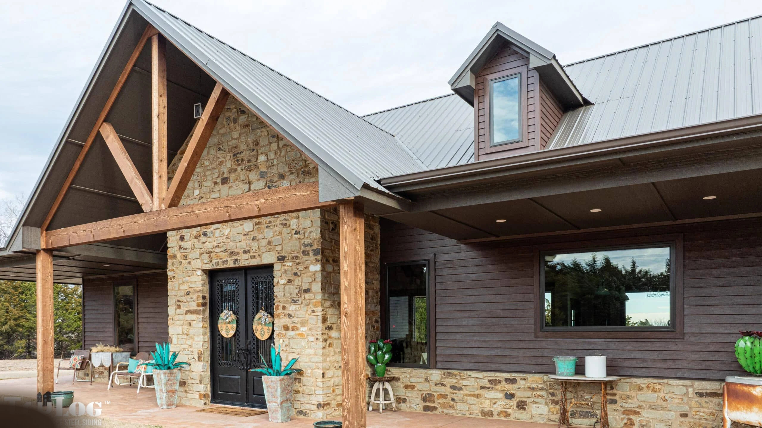 Traditional American home with TruLog steel lap siding in dark finish
