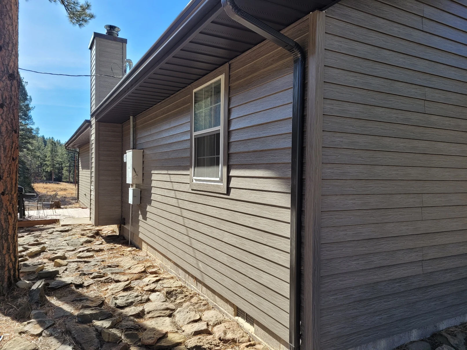 Traditional American home with TruLog steel lap siding in driftwood finish