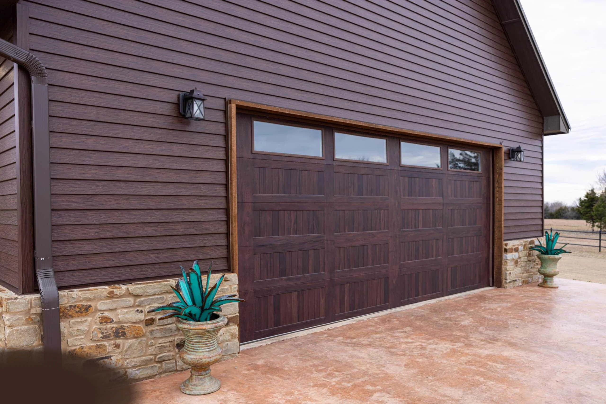 Traditional American home with TruLog steel lap siding garage