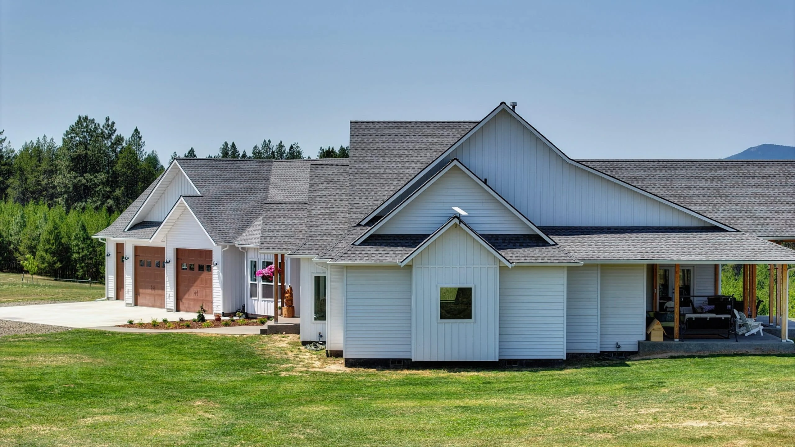 White colonial-style home with TruLog steel lap siding