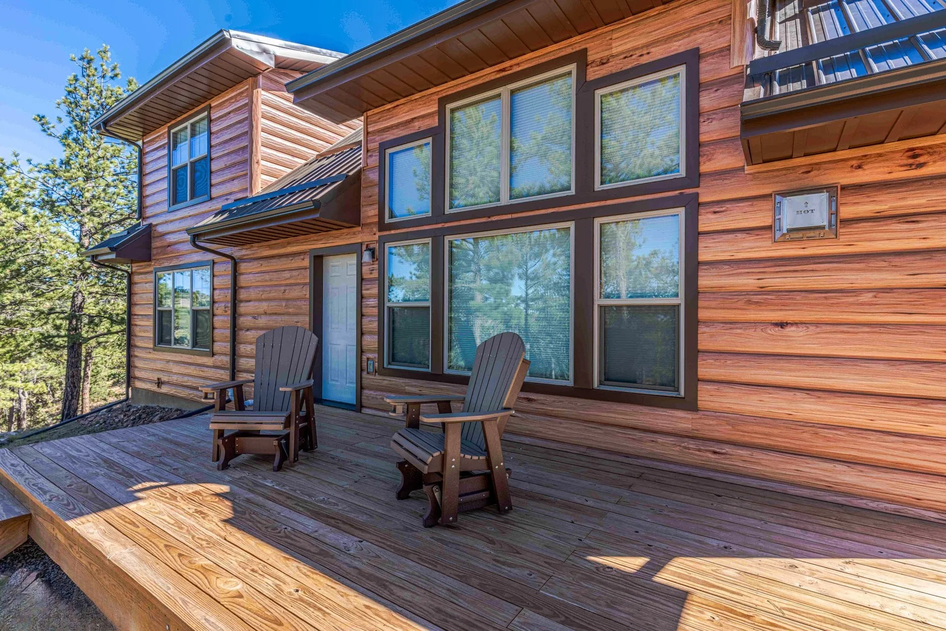 Steel log siding on a cabin