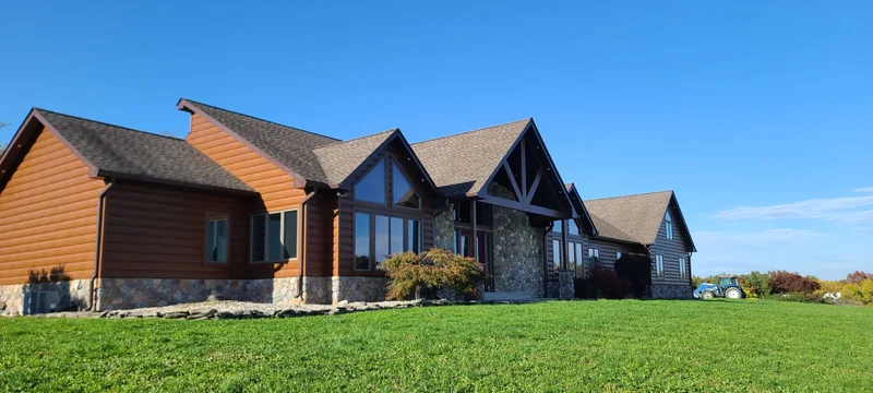 Ranch home with TruLog steel log siding and stone accents